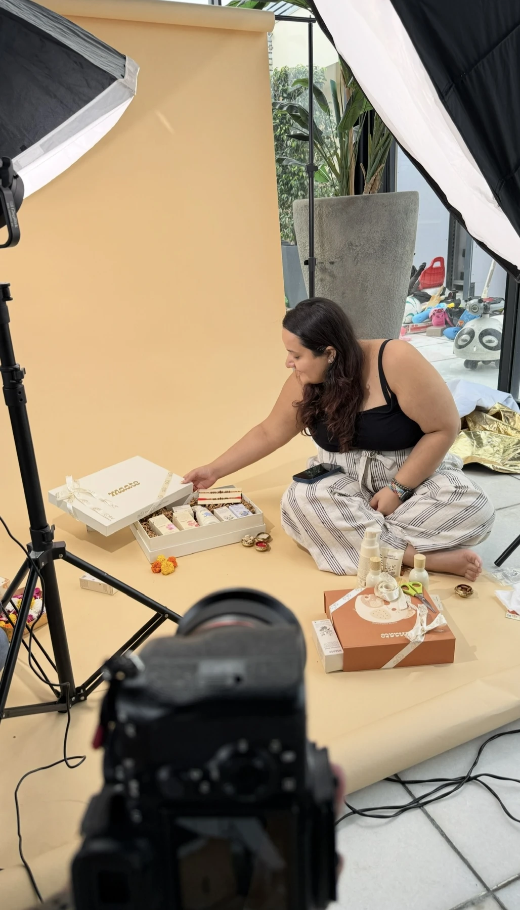 Srishti arranging Maate products on set