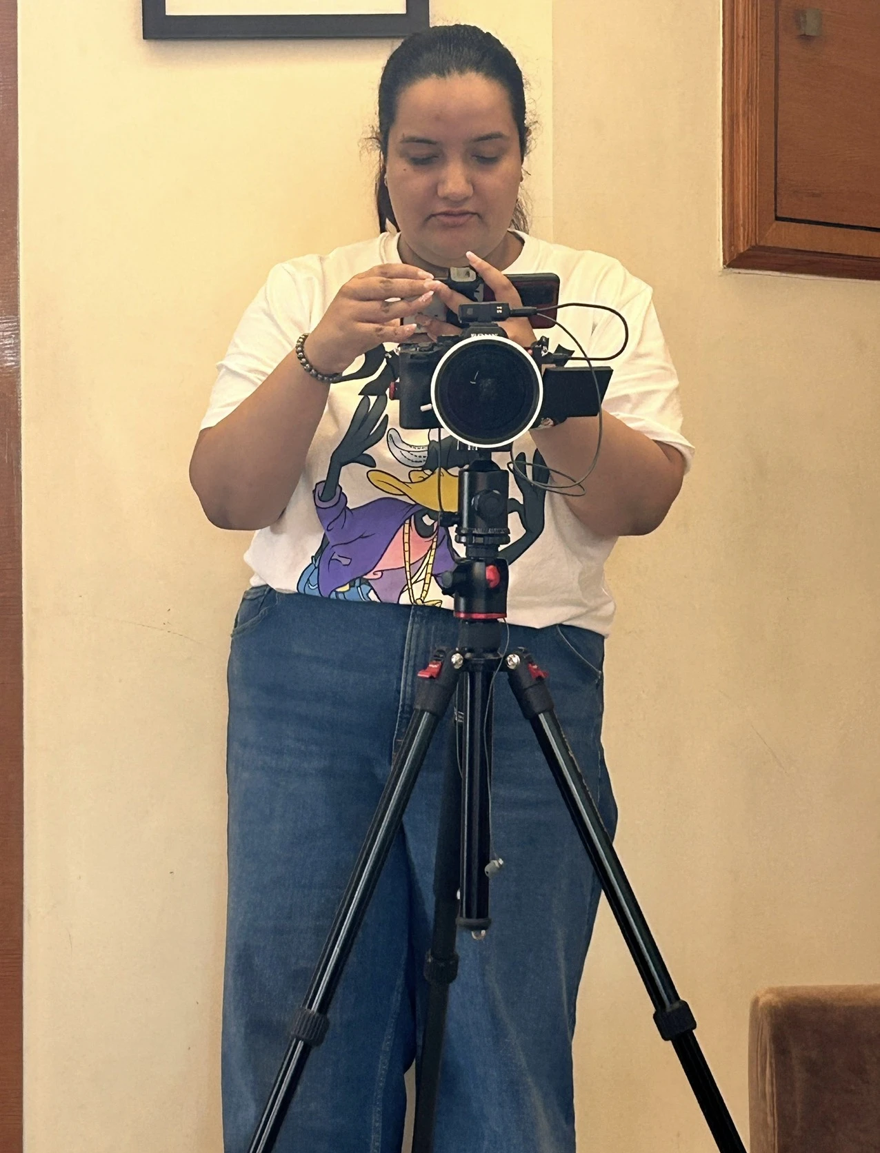 Srishti preparing a camera for filming
